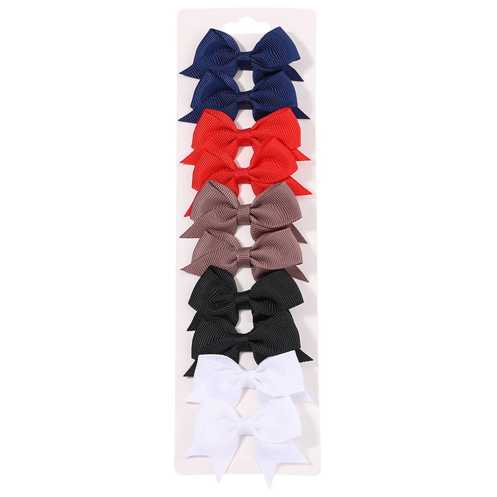 Lot de 10 pinces à cheveux unies avec nœuds pour bébés filles, barrettes à nœuds faites à la main, accessoires capillaires pour le Nouvel An