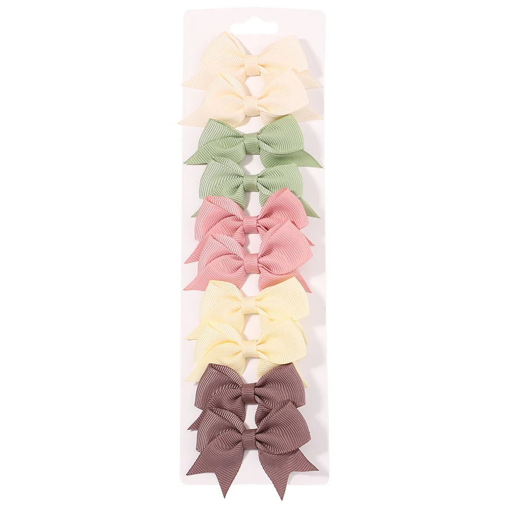 Lot de 10 pinces à cheveux unies avec nœuds pour bébés filles, barrettes à nœuds faites à la main, accessoires capillaires pour le Nouvel An