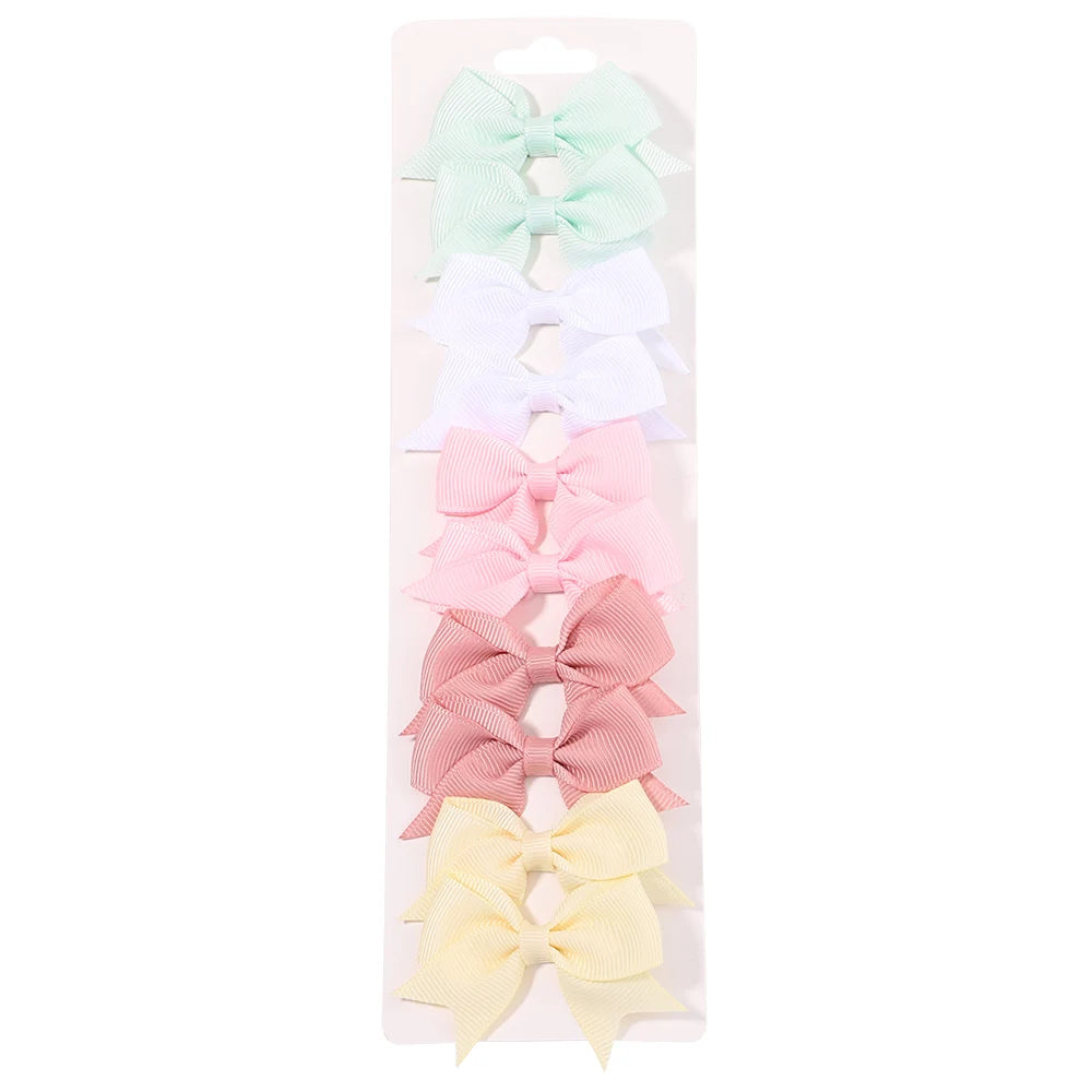 Lot de 10 pinces à cheveux unies avec nœuds pour bébés filles, barrettes à nœuds faites à la main, accessoires capillaires pour le Nouvel An