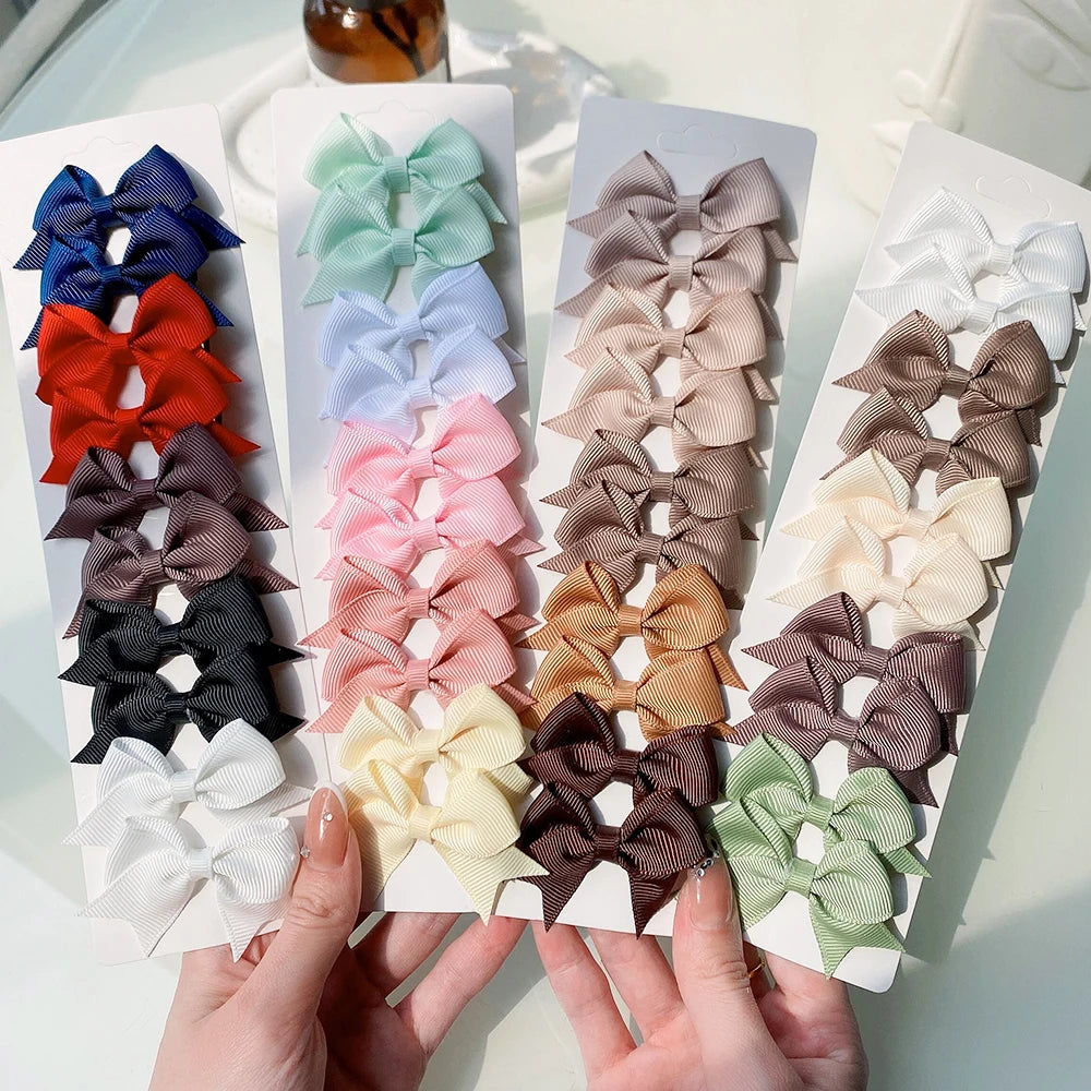 Lot de 10 pinces à cheveux unies avec nœuds pour bébés filles, barrettes à nœuds faites à la main, accessoires capillaires pour le Nouvel An