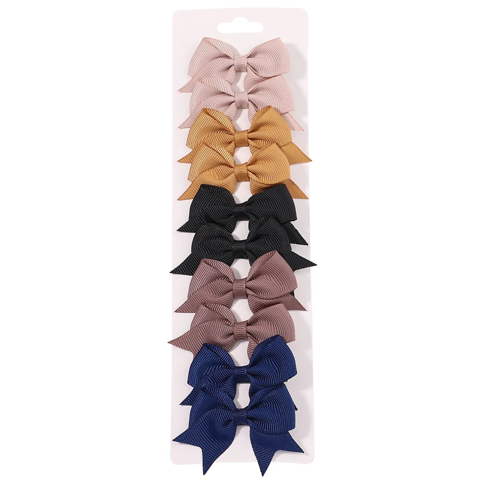 Lot de 10 pinces à cheveux unies avec nœuds pour bébés filles, barrettes à nœuds faites à la main, accessoires capillaires pour le Nouvel An