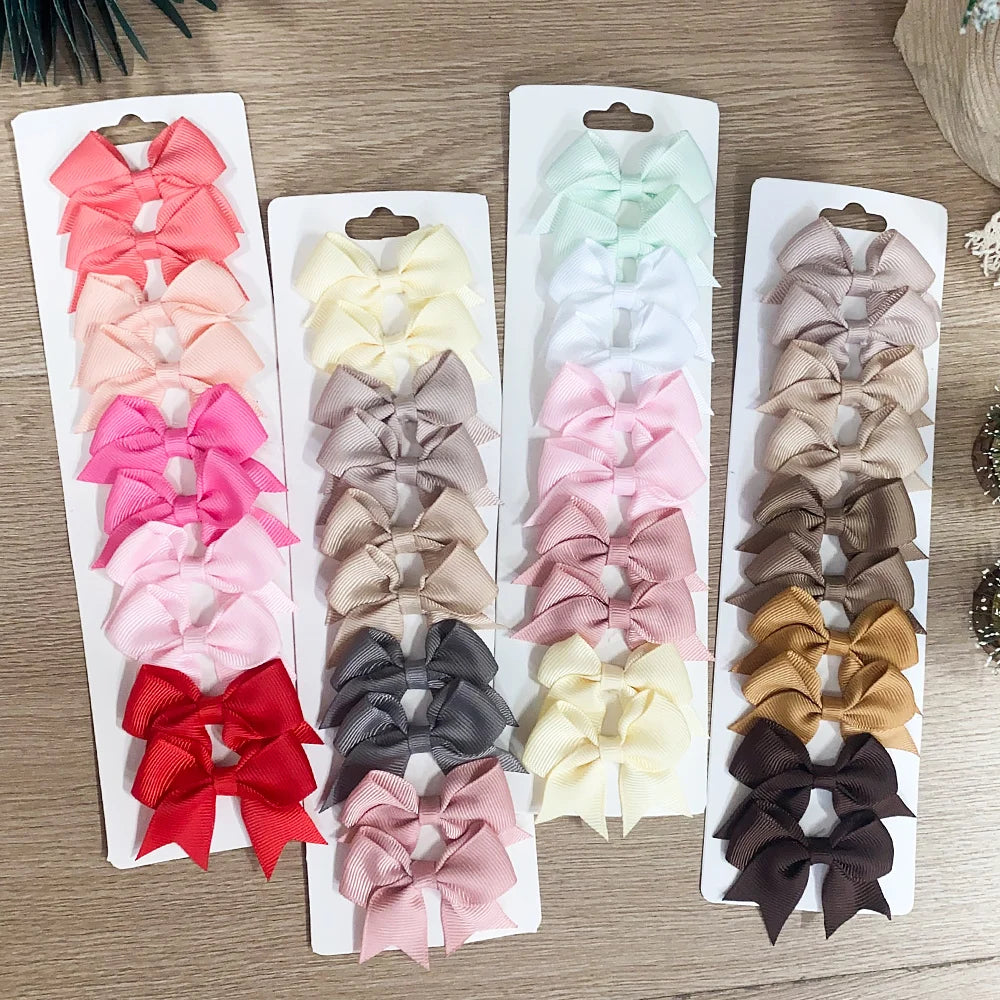 Lot de 10 pinces à cheveux unies avec nœuds pour bébés filles, barrettes à nœuds faites à la main, accessoires capillaires pour le Nouvel An