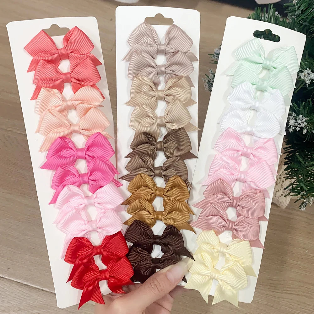 Lot de 10 pinces à cheveux unies avec nœuds pour bébés filles, barrettes à nœuds faites à la main, accessoires capillaires pour le Nouvel An