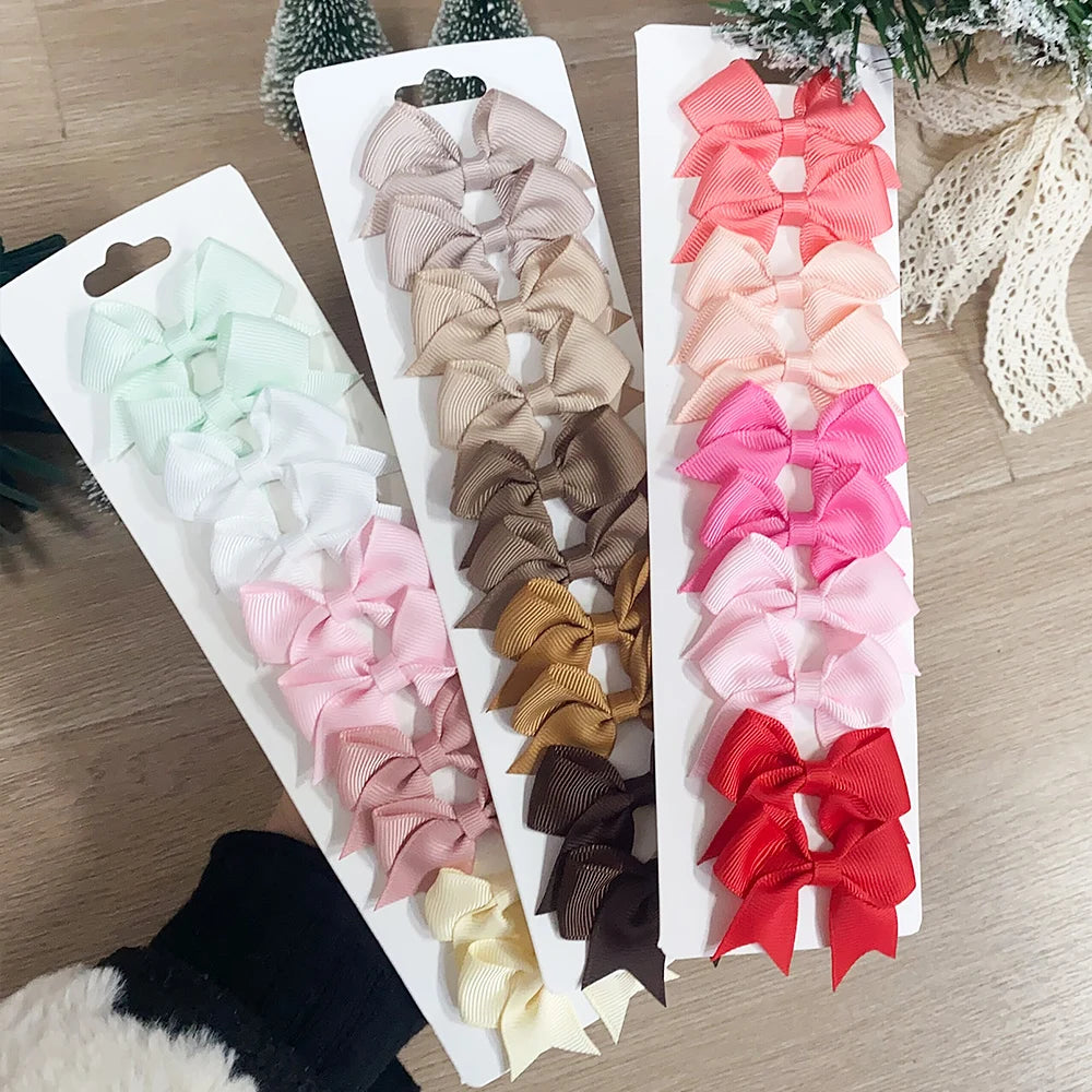 Lot de 10 pinces à cheveux unies avec nœuds pour bébés filles, barrettes à nœuds faites à la main, accessoires capillaires pour le Nouvel An