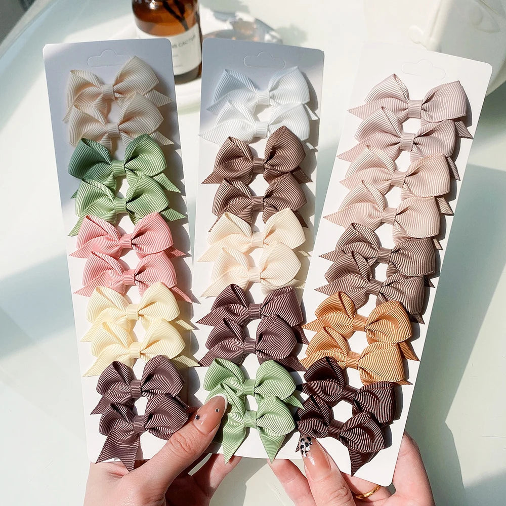 Lot de 10 pinces à cheveux unies avec nœuds pour bébés filles, barrettes à nœuds faites à la main, accessoires capillaires pour le Nouvel An
