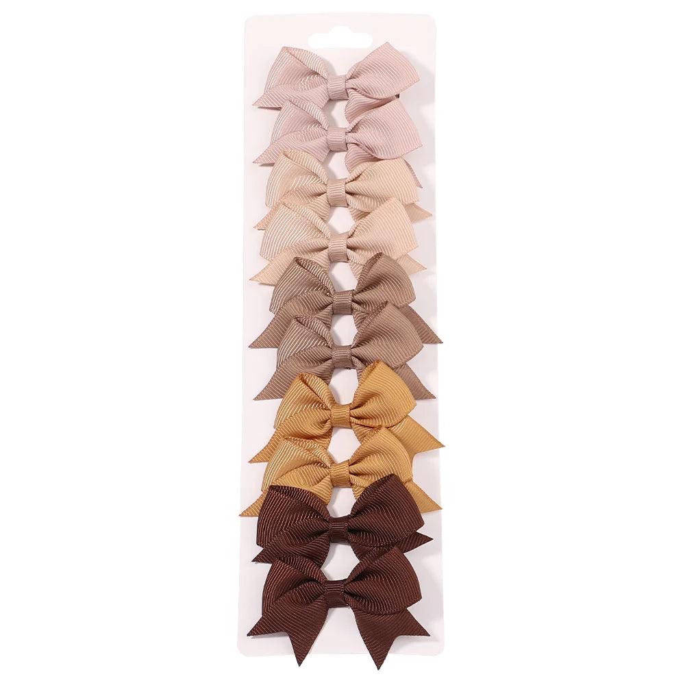 Lot de 10 pinces à cheveux unies avec nœuds pour bébés filles, barrettes à nœuds faites à la main, accessoires capillaires pour le Nouvel An