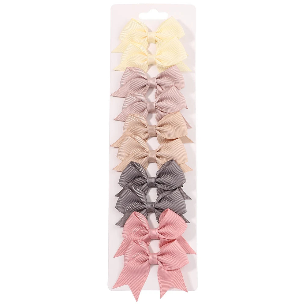 Lot de 10 pinces à cheveux unies avec nœuds pour bébés filles, barrettes à nœuds faites à la main, accessoires capillaires pour le Nouvel An
