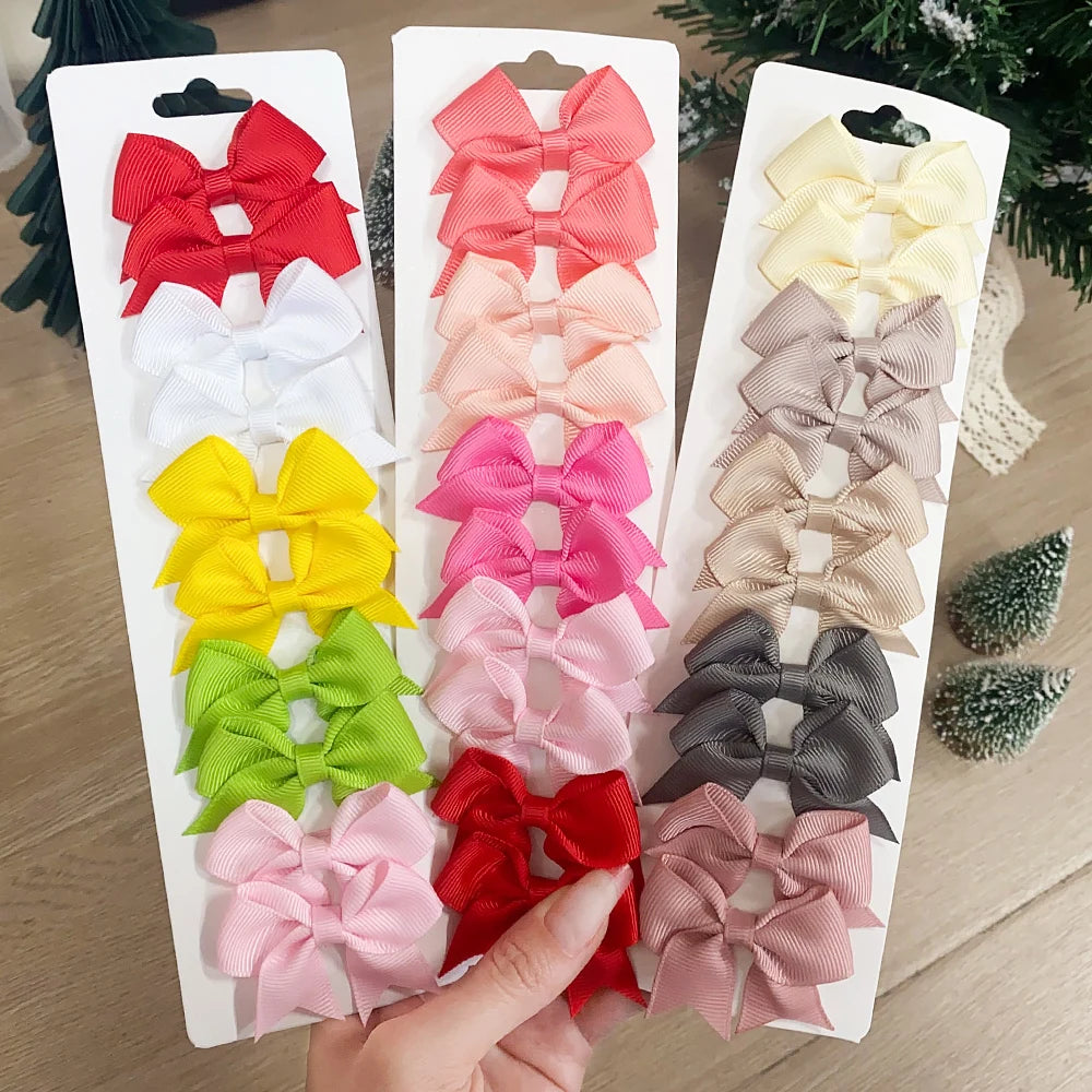 Lot de 10 pinces à cheveux unies avec nœuds pour bébés filles, barrettes à nœuds faites à la main, accessoires capillaires pour le Nouvel An