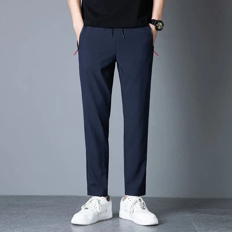 Men's casual pants straight leg slim fit elastic waist jogging pants Korean classic blue black gray men's pants plus size 4XL5XL