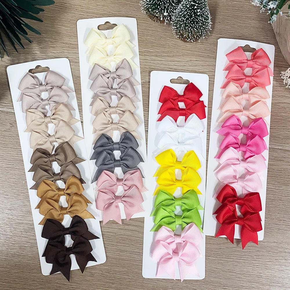 Lot de 10 pinces à cheveux unies avec nœuds pour bébés filles, barrettes à nœuds faites à la main, accessoires capillaires pour le Nouvel An
