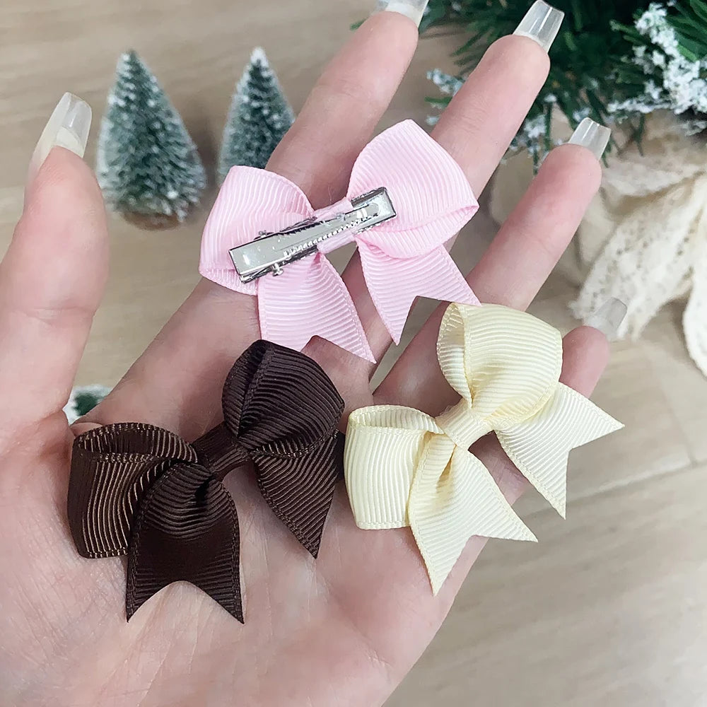 Lot de 10 pinces à cheveux unies avec nœuds pour bébés filles, barrettes à nœuds faites à la main, accessoires capillaires pour le Nouvel An