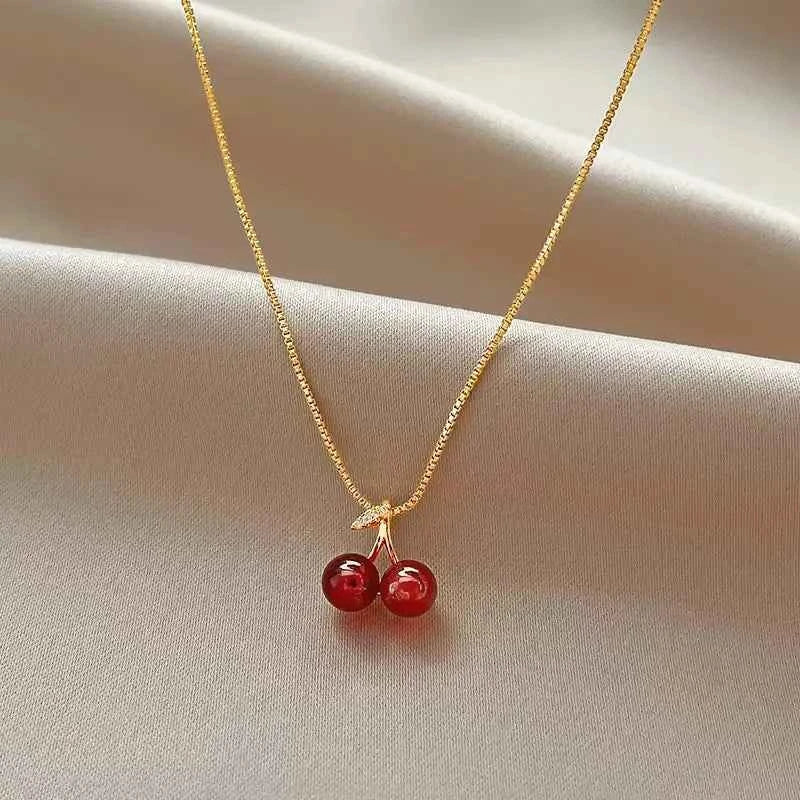 The 2025 summer classic sweet wine red cherry pendant necklace is a fashionable and individual fruit golden chain necklace for w