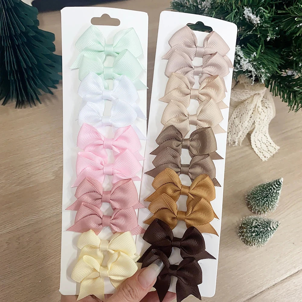 Lot de 10 pinces à cheveux unies avec nœuds pour bébés filles, barrettes à nœuds faites à la main, accessoires capillaires pour le Nouvel An