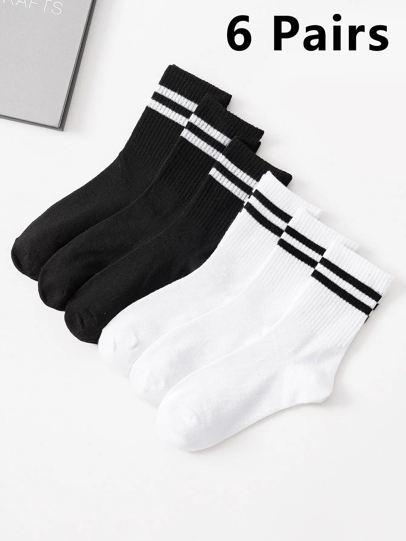 Lot de 6 paires de chaussettes hautes mi-mollet pour femme, noir et blanc pur, avec rayures parallèles, populaires et absorbantes.