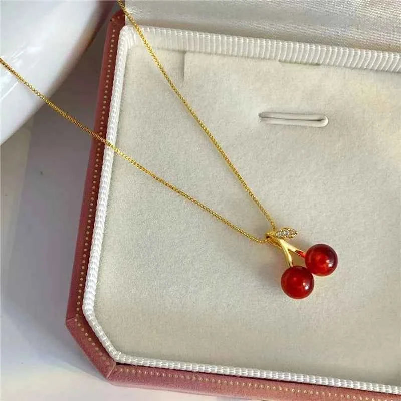 The 2025 summer classic sweet wine red cherry pendant necklace is a fashionable and individual fruit golden chain necklace for w