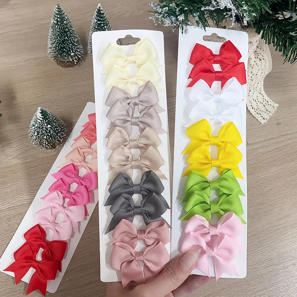 Lot de 10 pinces à cheveux unies avec nœuds pour bébés filles, barrettes à nœuds faites à la main, accessoires capillaires pour le Nouvel An