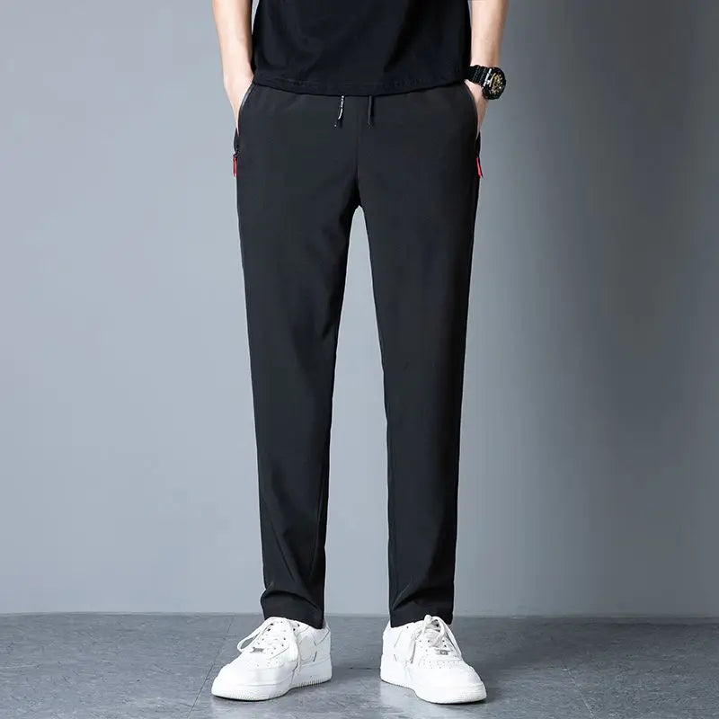 Men's casual pants straight leg slim fit elastic waist jogging pants Korean classic blue black gray men's pants plus size 4XL5XL