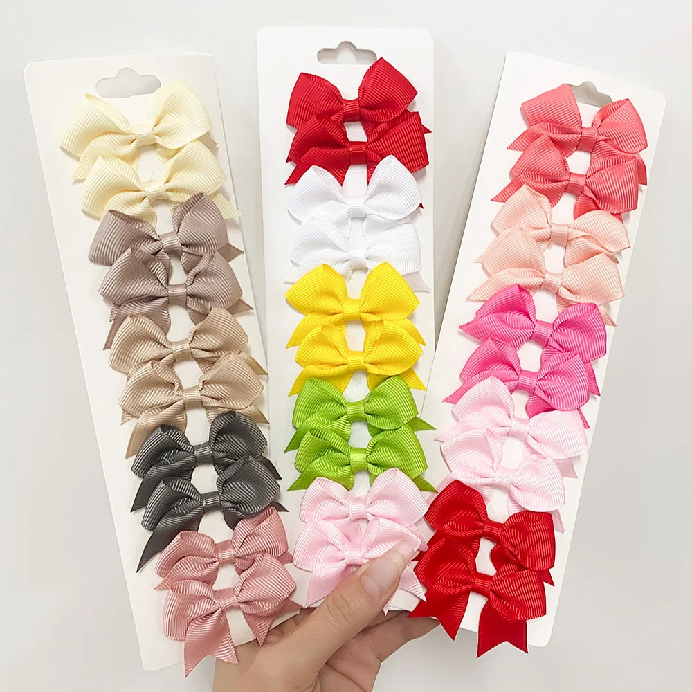 Lot de 10 pinces à cheveux unies avec nœuds pour bébés filles, barrettes à nœuds faites à la main, accessoires capillaires pour le Nouvel An